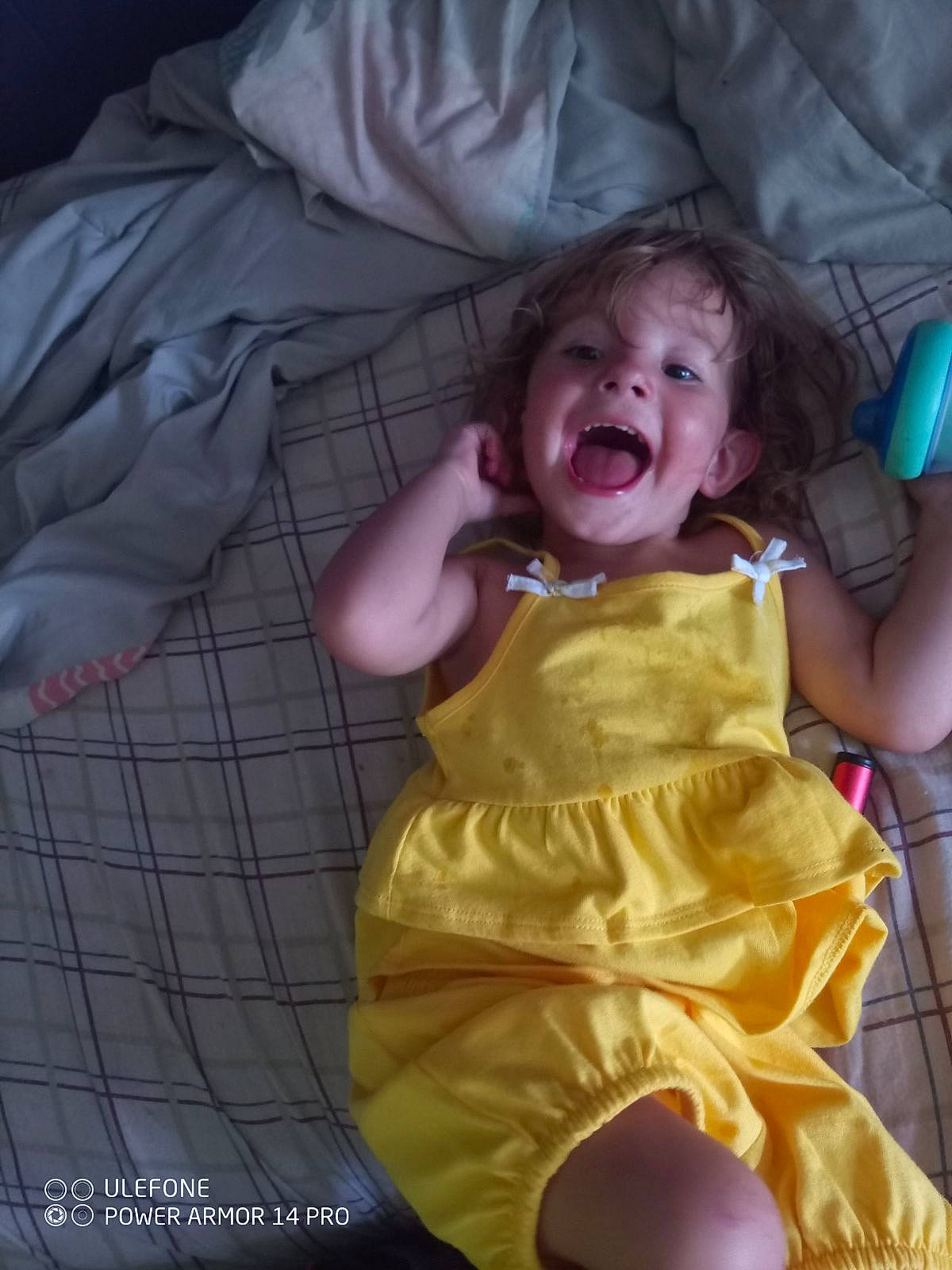 Haven is registered to the contest to win money with this photo: baby, baby_products, baby_toddler_clothing, bed, cheek, child, comfort, event, fun, happy, linens, magenta, mouth, pattern, person, room, ruffle, sitting, smile, textile