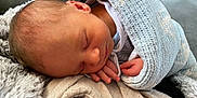 Ryder joined the competition — help win amazing prizes! baby, blanket, face, head, newborn, person, quilt, sleeping, yawning