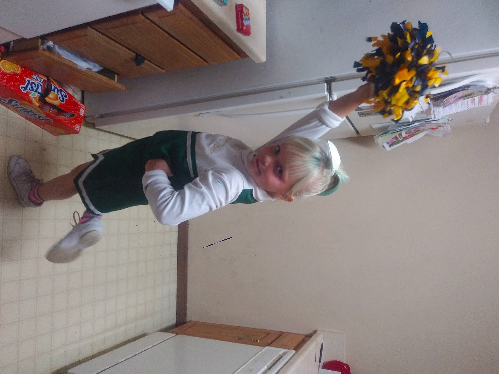 Ashby is registered to the contest to win money with this photo: artificial_flower, athletic_shoe, balance, bouquet, box, cut_flowers, flower_arranging, outdoor_shoe, person, room, shipping_box, sneakers, sock, sunflower, walking_shoe