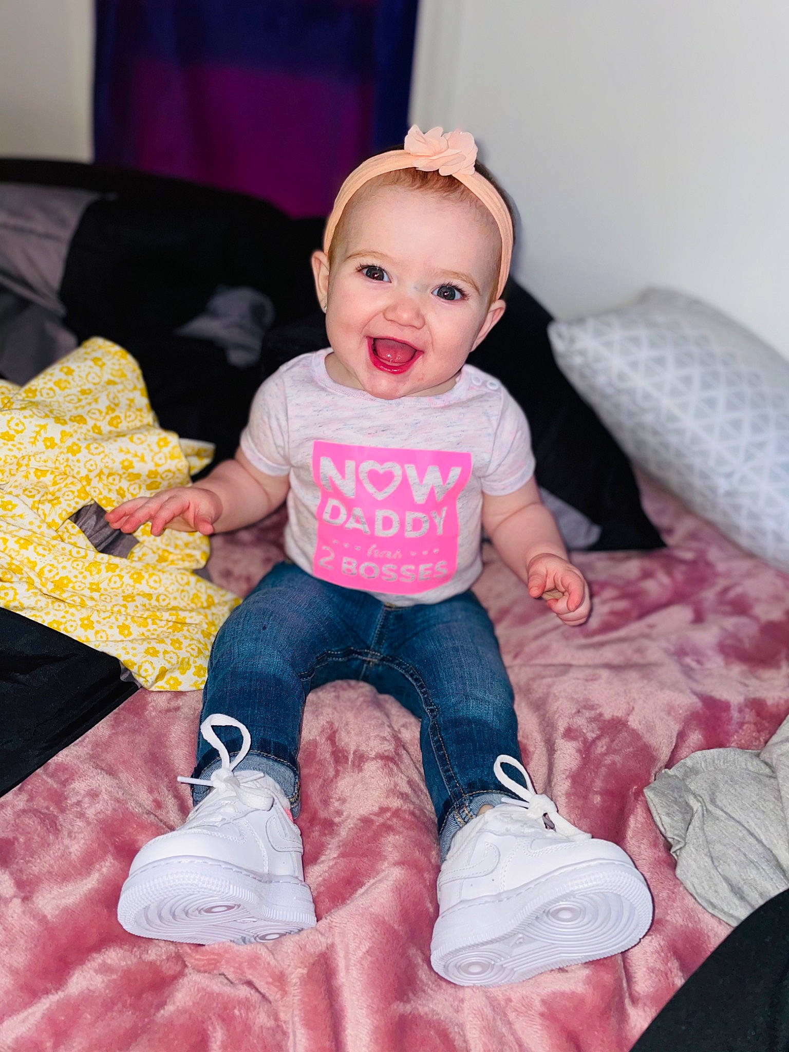 Deslynn is registered to the contest to win money with this photo: baby, baby_toddler_clothing, cheek, child, comfort, couch, eye, finger, happy, joy, lap, magenta, mammal, person, pink, product, purple, skin, sleeve, smile