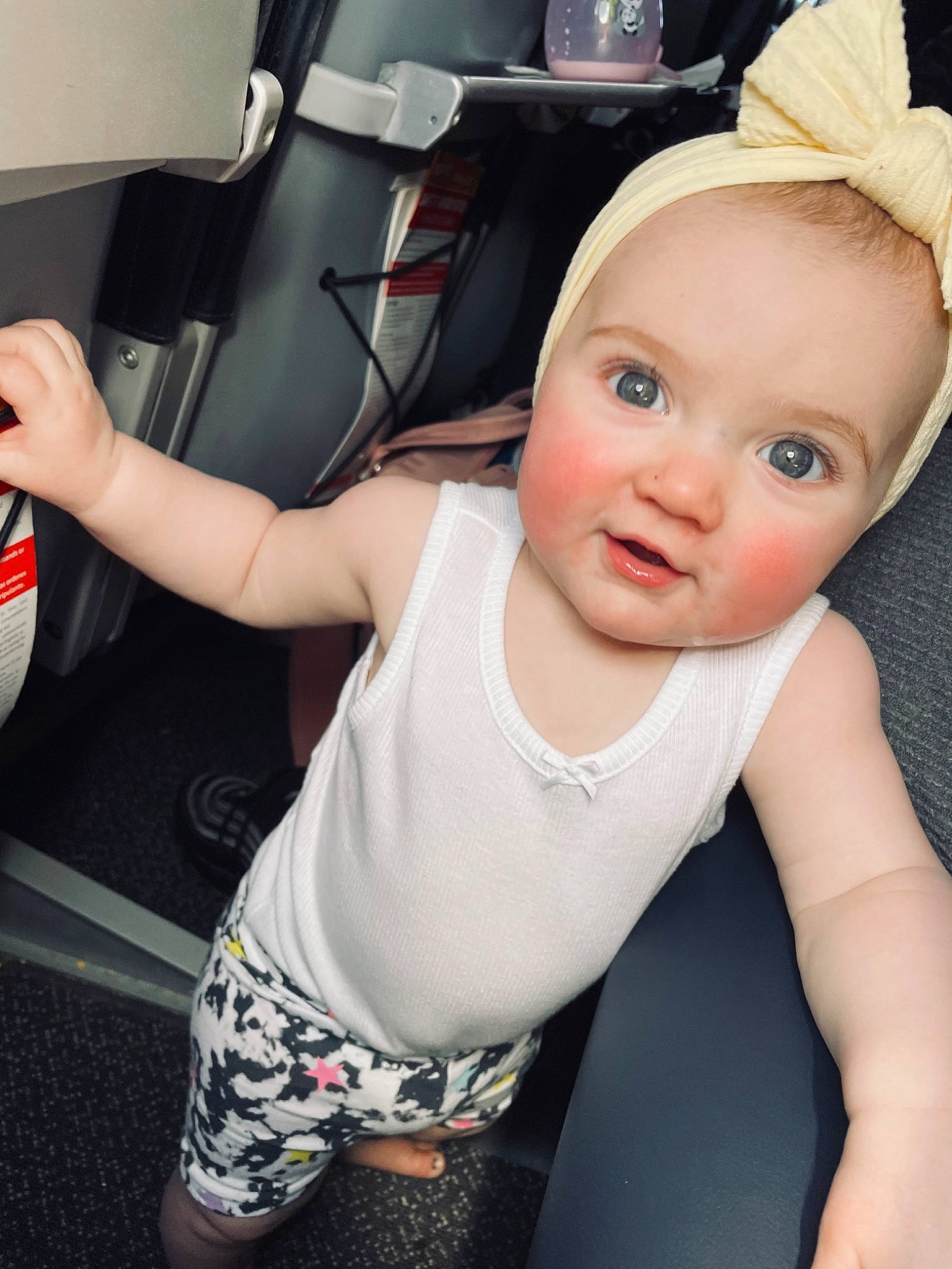 Deslynn is registered to the contest to win money with this photo: arm, automotive_tire, baby, baby_toddler_clothing, cap, chest, cool, elbow, finger, flash_photography, happy, human_body, knee, mouth, neck, person, sleeve, sportswear, t_shirt, thigh