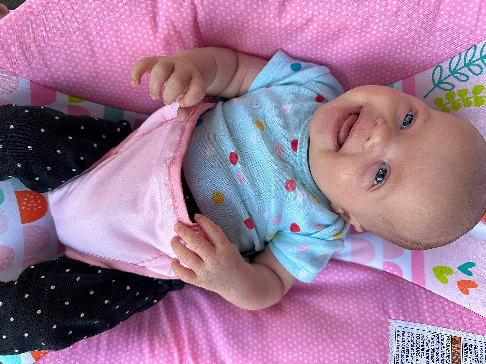 Amara is registered to the contest to win money with this photo: baby, baby_products, baby_safety, baby_toddler_clothing, child, comfort, hand, linens, nail, pattern, person, pink, product, skin, sleeve, textile, toddler