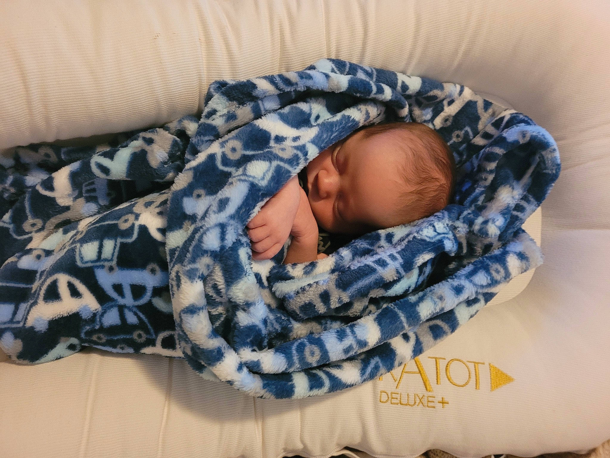 Collins is registered to the contest to win money with this photo: baby, baby_products, baby_sleeping, baby_toddler_clothing, bedding, bedtime, child, comfort, linens, nap, pattern, person, room, sleep, sleeve, textile, toddler