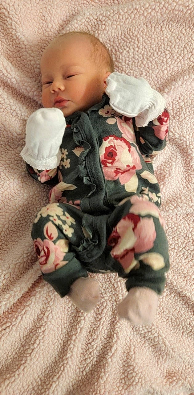 Stormy is registered to the contest to win money with this photo: baby, baby_products, baby_toddler_clothing, carmine, cheek, child, clothing, comfort, eye, face, head, linens, pattern, person, pink, product, skin, sleeve, sock, textile