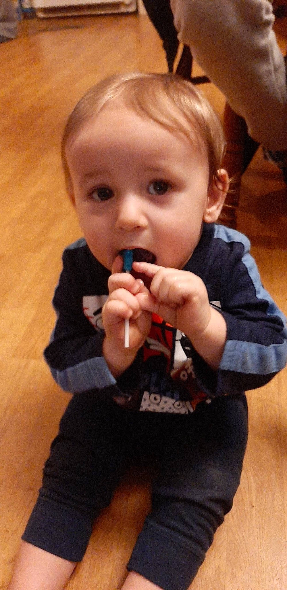 Preston is registered to the contest to win money with this photo: arm, baby, baby_toddler_clothing, cheek, ear, eyelash, finger, flooring, gesture, hand, happy, iris, lip, mouth, nail, nose, person, skin, sleeve, surprise