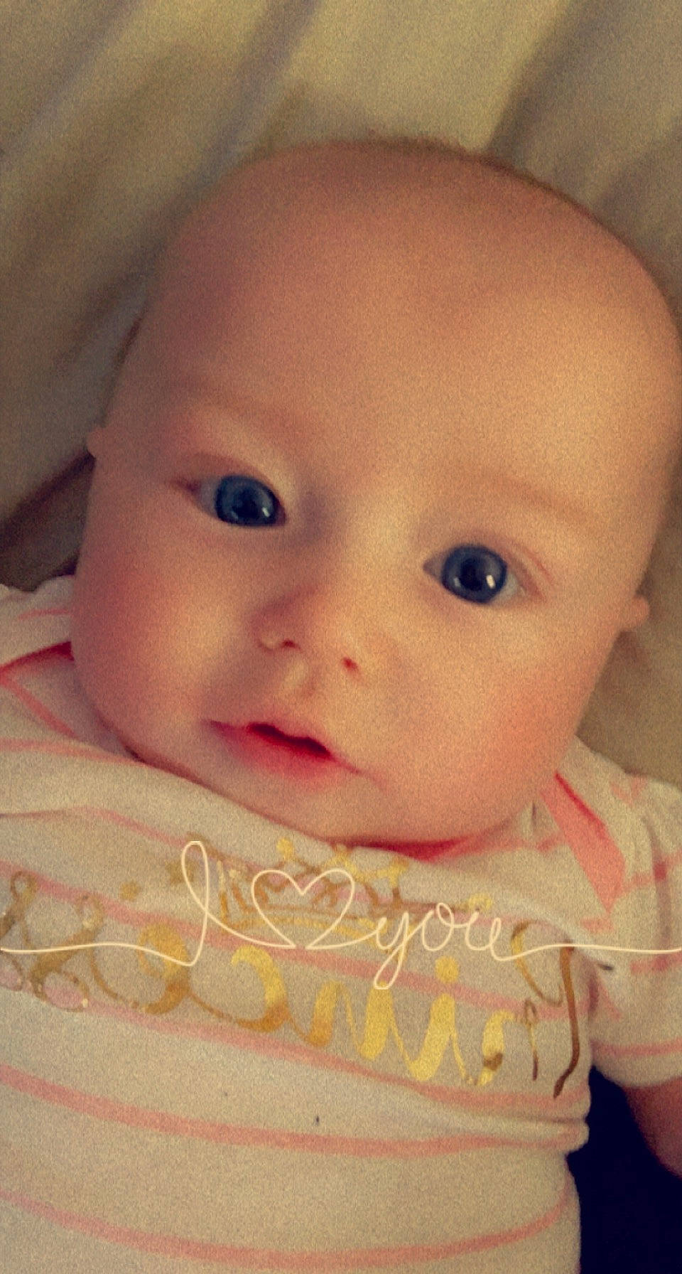 Adalynn joined the competition — help win amazing prizes! baby, baby_toddler_clothing, cheek, child, eyebrow, eyelash, facial_expression, happy, iris, linens, lip, nose, pattern, peach, person, pink, portrait_photography, sitting, skin, toddler