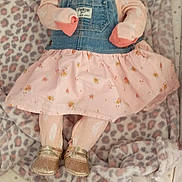 Estrella Luna is registered to the contest to win money with this photo: baby, blanket, child, cute, denim, dress, fabric, footwear, gold_shoes, headband, indoor, infant, laying_down, leopard_print, pacifier, pattern, person, pink, sleepy, soft_toys