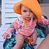 Layla joined the competition — help win amazing prizes! baby, child, orange_hat, pink_swimsuit, floral_pattern, lounge_chair, towel, blue_eyes, outdoor, summer, sun_protection, cute, serious_expression, skin, person, infant, seat, legs, hand, daylight