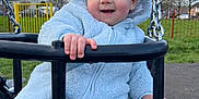 Morgan is registered to the contest to win money with this photo: baby, car, clothing, face, grass, head, knitwear, nature, outdoorplayarea, outdoors, park, person, photography, plant, playarea, portrait, sweater, toy, transportation, vehicle