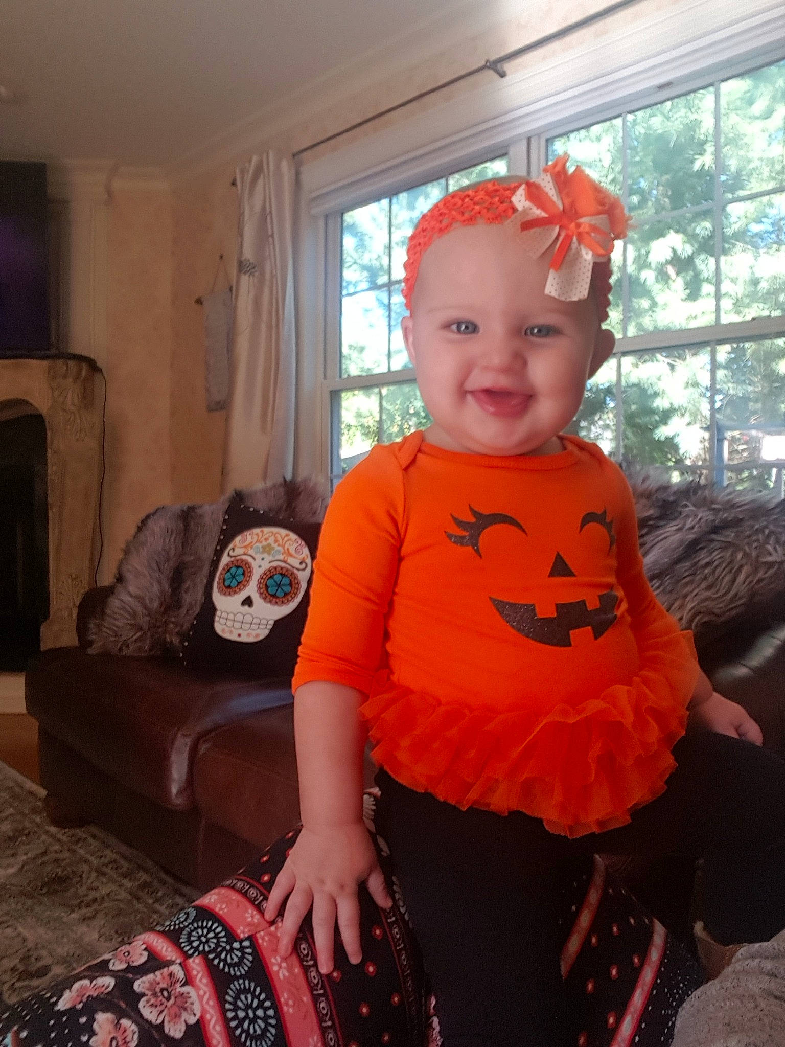Carina is registered to the contest to win money with this photo: child, clothing, costume, day, fun, girl, hair_accessory, halloween, infant, orange, person, pink, product, red, skin, smile, t_shirt, textile, toddler