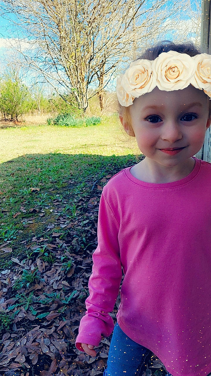 Abigail is registered to the contest to win money with this photo: baby_toddler_clothing, blue, child, clothing, cool, electric_blue, fun, grass, happy, headgear, headpiece, headwear, joy, magenta, people_in_nature, person, pink, plant, sky, sleeve