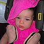 Gianna is registered to the contest to win money with this photo: baby, child, car_seat, pink_towel, pink_clothing, blue_eyes, safety_harness, toddler, seatbelt, face, hand, infant, curly_hair, closeup, indoor, portrait, cute, expression, child_safety, car_accessory