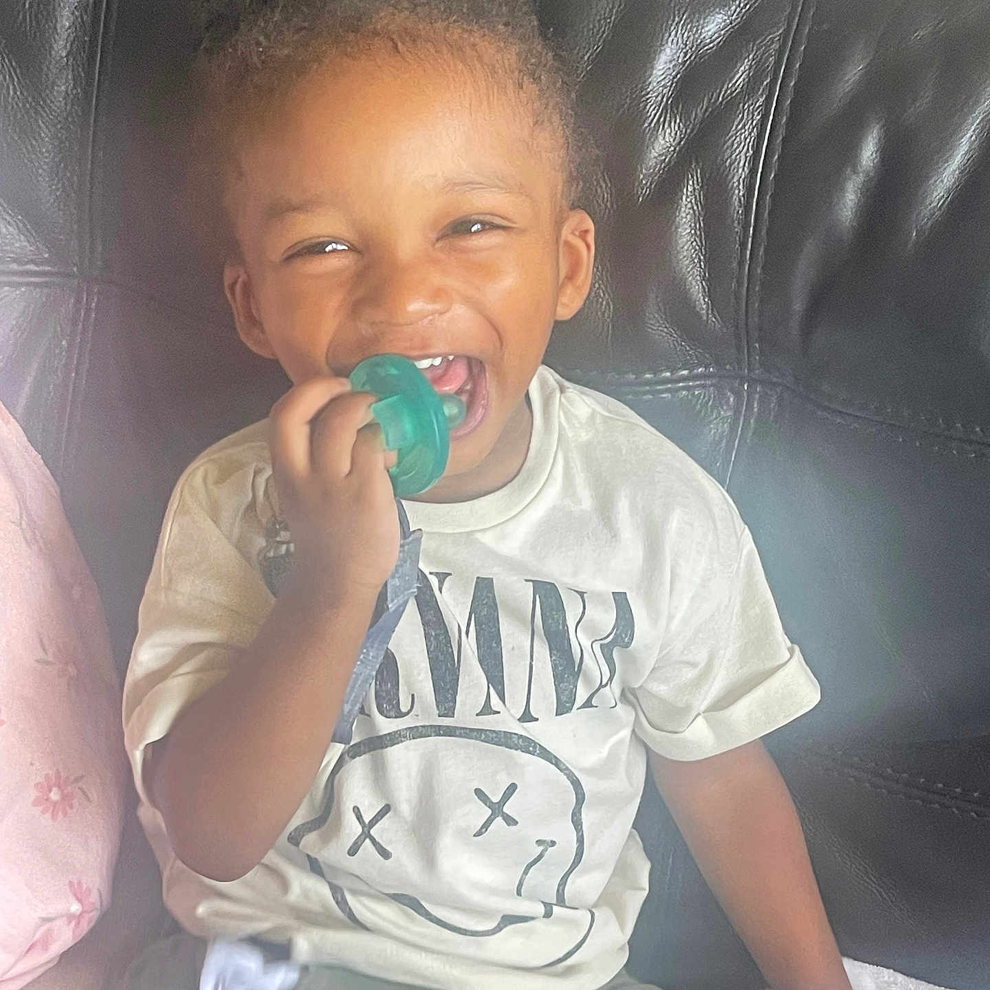 Messiah is registered to the contest to win money with this photo: baby, babylaughing, biting, boy, child, clothing, couch, cream, dessert, face, furniture, happy, head, male, person, photography, portrait, sitting, sleeve, t_shirt