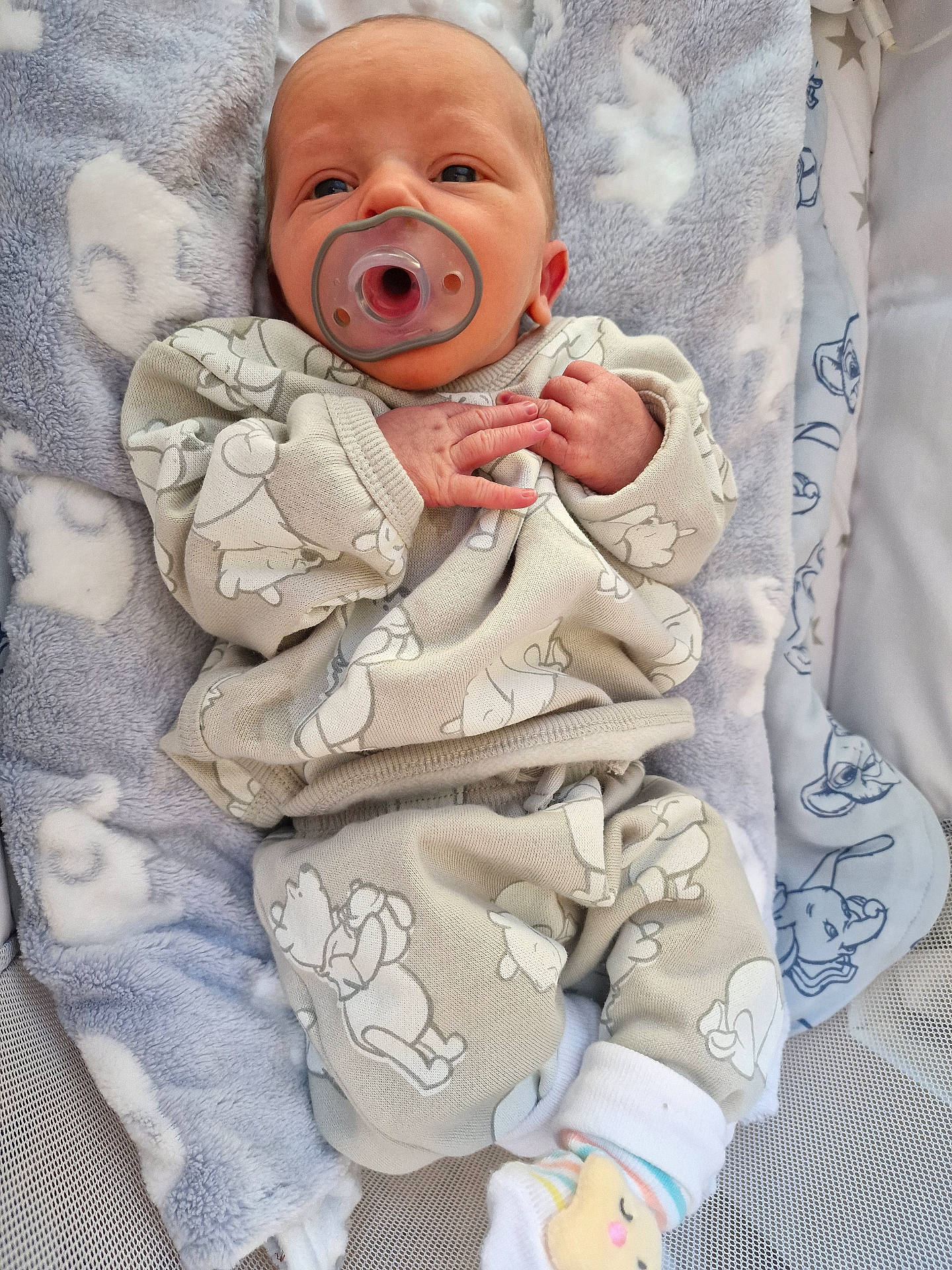 Lucario joined the competition — help win amazing prizes! baby, baby_bedding, baby_sock, blanket, child, clothing, comfort, cute, face, hands, indoors, infant, lying_down, newborn, pacifier, pajamas, patterned_clothing, resting, sleepwear, soft