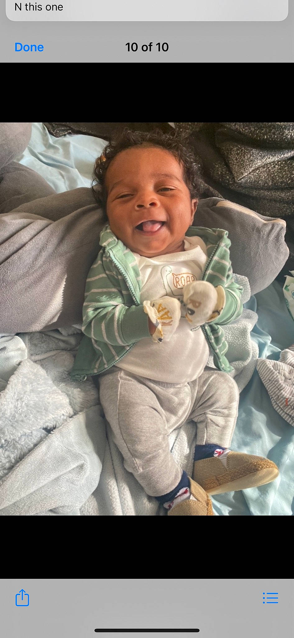 Makai is registered to the contest to win money with this photo: baby, baby_carriage, baby_products, baby_toddler_clothing, cheek, child, comfort, face, gesture, hand, happy, linens, mouth, person, skin, sleeve, smile, textile, thumb, toddler