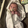 baby, towel, pacifier, infant, newborn, wrapped, clothing, face, hand, skin, blanket, bed, baby_wipes, soft, cute, lying_down, indoors, newborn_care, bath_time, expression