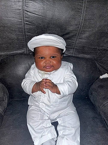 Tyson joined the competition — help win amazing prizes! baby, baby_toddler_clothing, cap, child, comfort, costume_hat, couch, eye, flash_photography, happy, headwear, human_body, linens, monochrome, monochrome_photography, person, portrait_photography, room, sitting, sleeve