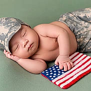 Roland joined the competition — help win amazing prizes! baby, sleeping, camouflage, hat, pants, flag, american_flag, hand, peaceful, soft_surface, infant, cute, patriotic, resting, child, skin, portrait, peace, newborn, lying_down