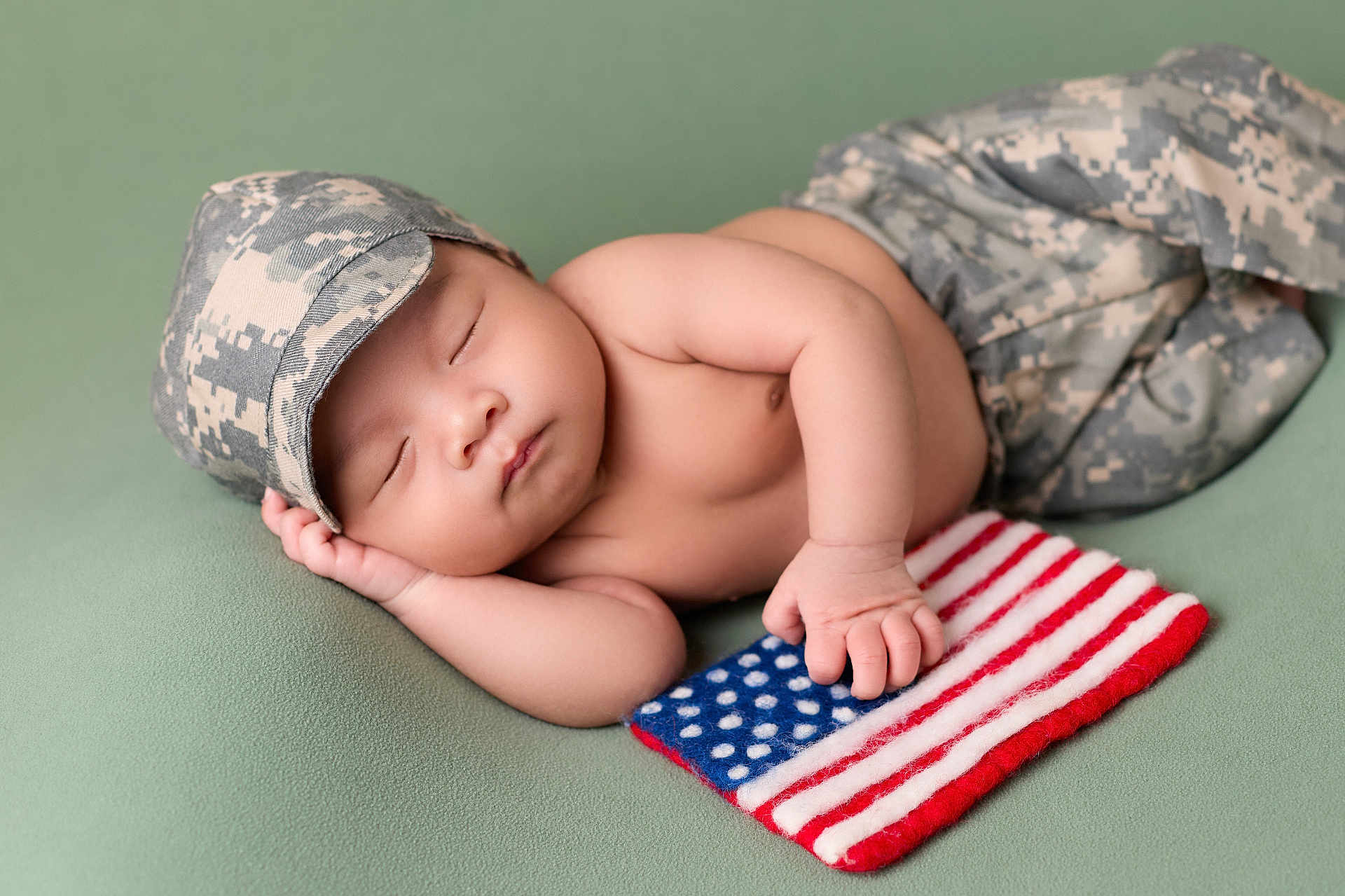 Roland joined the competition — help win amazing prizes! baby, sleeping, camouflage, hat, pants, flag, american_flag, hand, peaceful, soft_surface, infant, cute, patriotic, resting, child, skin, portrait, peace, newborn, lying_down