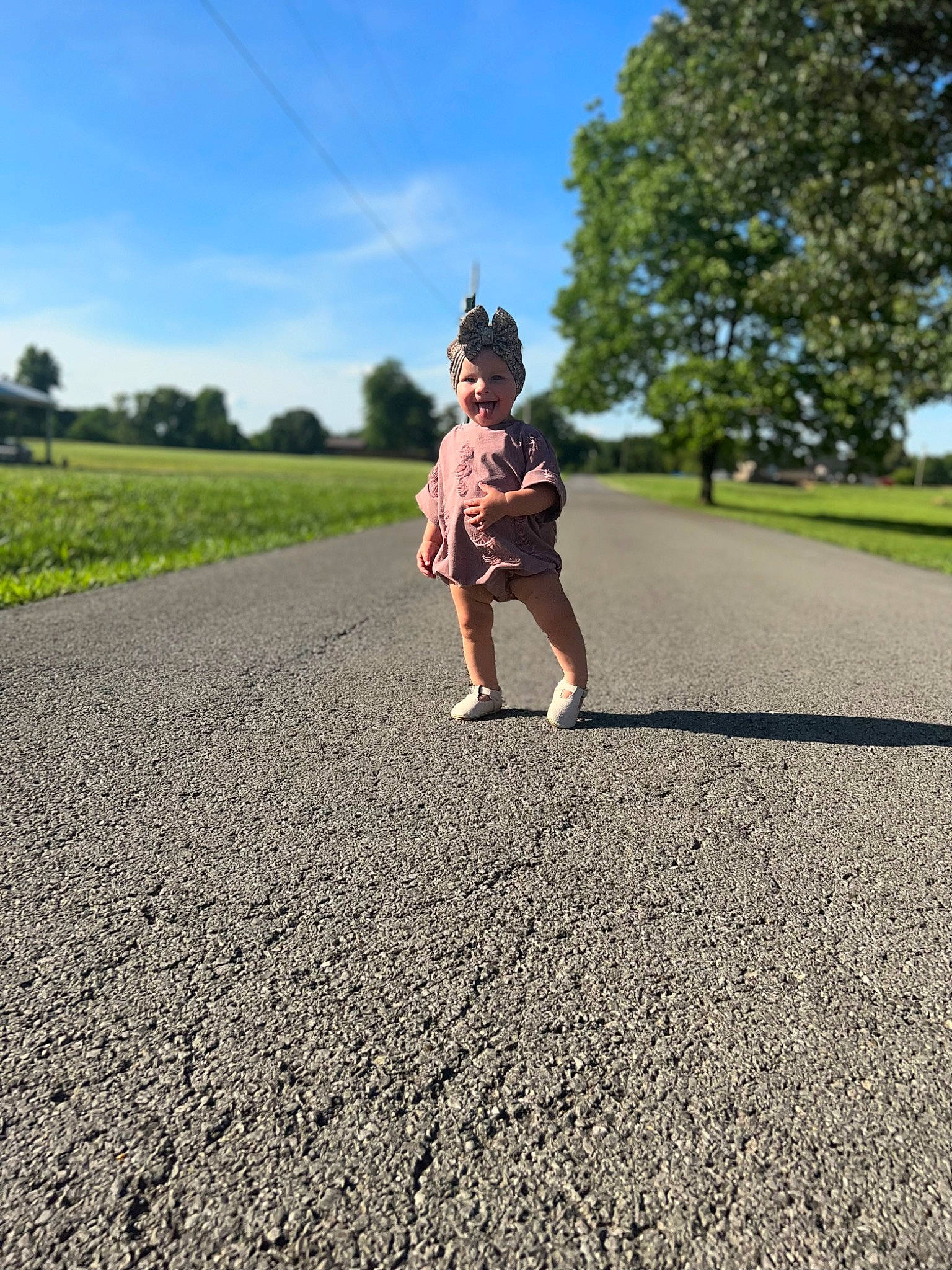 Oakleigh joined the competition — help win amazing prizes! asphalt, cloud, field, gesture, grass, grassland, happy, headwear, human_leg, joy, landscape, meadow, people_in_nature, person, plain, plant, recreation, road, road_surface, sky