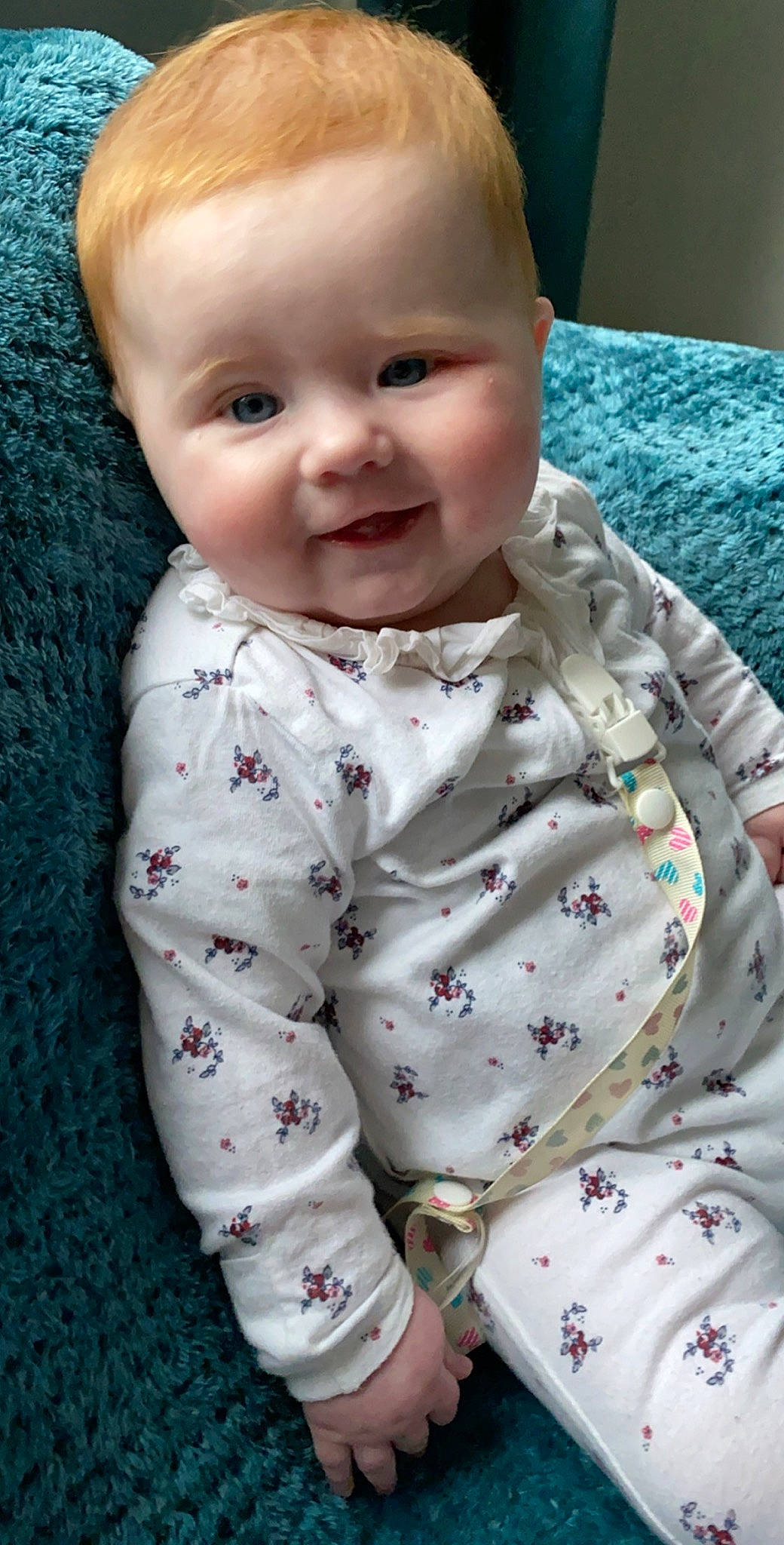 Lily-ann is registered to the contest to win money with this photo: baby, baby_toddler_clothing, cheek, child, face, head, lip, outerwear, pattern, person, skin, sleeve, smile, toddler