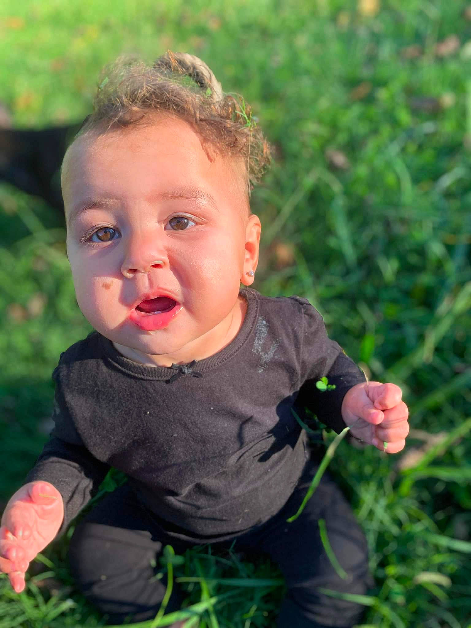 Peyton joined the competition — help win amazing prizes! baby, baby_toddler_clothing, cheek, eye, finger, gesture, grass, hand, happy, head, iris, leaf, lip, nose, people_in_nature, person, plant, skin, thumb, toddler