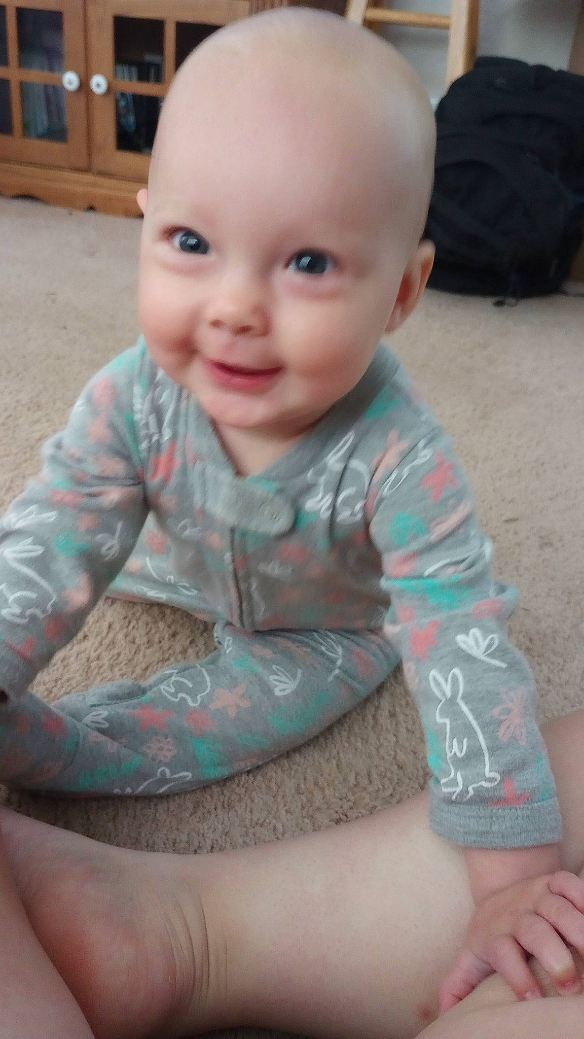 Adaline joined the competition — help win amazing prizes! baby, baby_toddler_clothing, cheek, child, chin, elbow, eye, facial_expression, flooring, happy, human_body, joy, mouth, nose, person, pink, sitting, skin, sleeve, smile