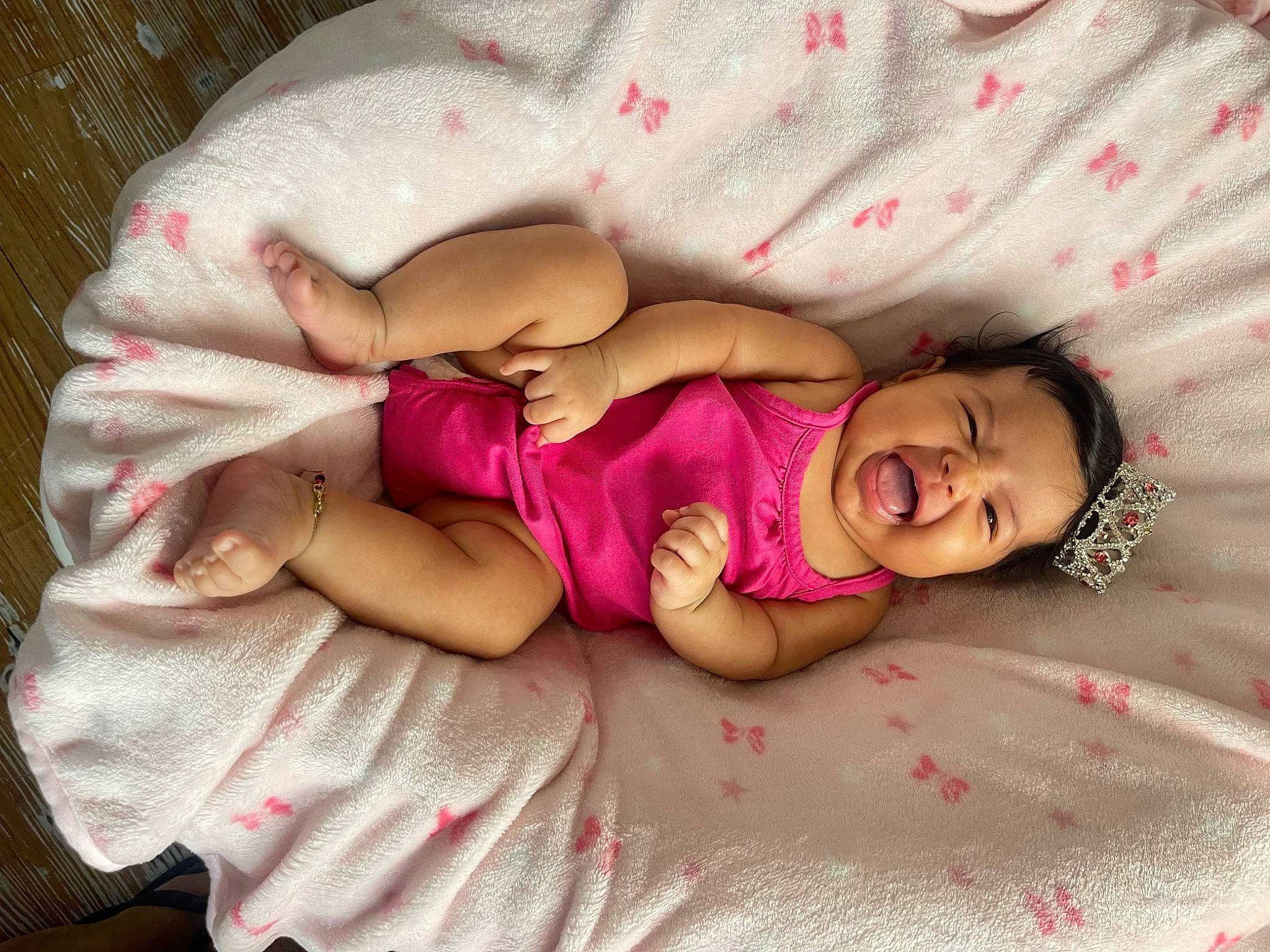 Lilibeth is registered to the contest to win money with this photo: arm, baby, baby_sleeping, baby_toddler_clothing, comfort, dress, eye, face, facial_expression, finger, hand, head, human_body, leg, mouth, person, pink, product, skin, smile