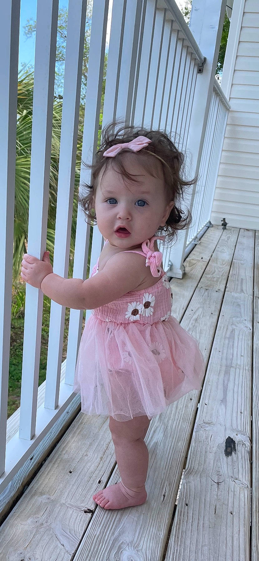 Bexley is registered to the contest to win money with this photo: baby, baby_toddler_clothing, child, day_dress, dress, embellishment, face, hair, hairstyle, hardwood, iris, lip, magenta, pattern, person, pink, standing, surprise, toddler, waist