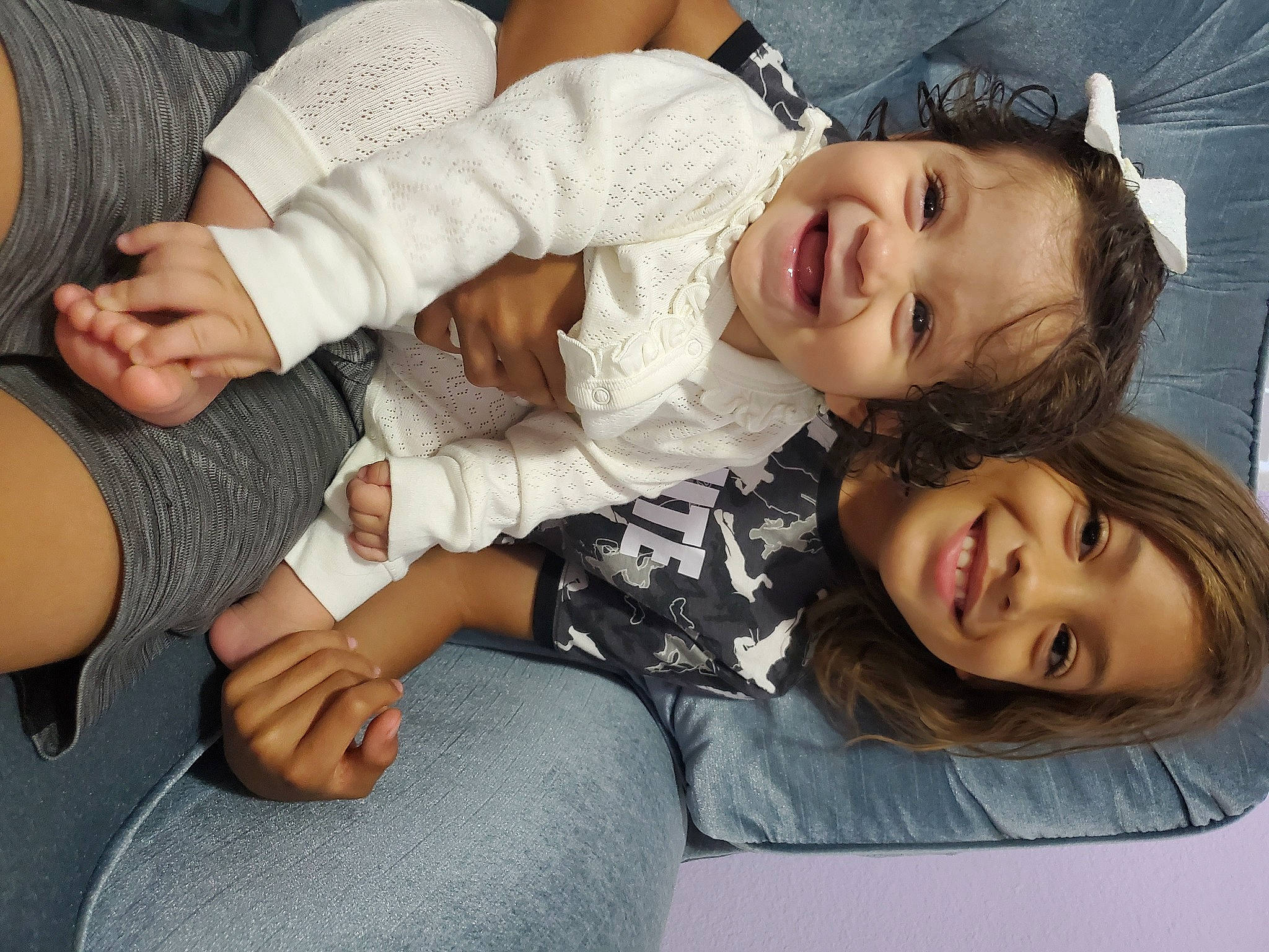 Kevin Jr is registered to the contest to win money with this photo: arm, beauty, child, clothing, comfort, dress, elbow, flash_photography, fun, gesture, happy, human_leg, joy, knee, lap, person, skin, smile, thigh, toddler