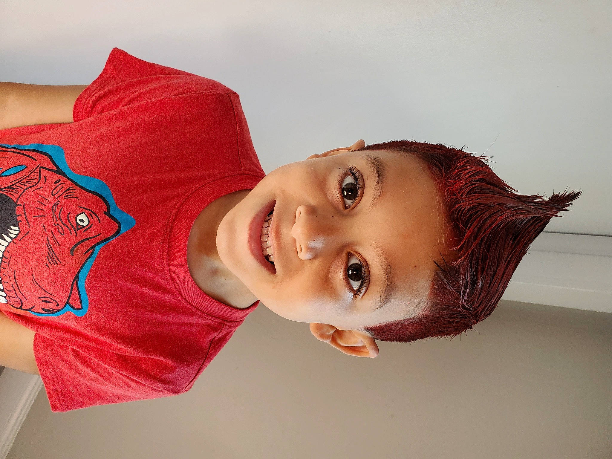 Ethan is registered to the contest to win money with this photo: chin, elbow, eye, eyelash, flash_photography, forehead, gesture, hair, happy, head, headgear, human_body, joy, lip, mouth, neck, nose, person, shoulder, skin