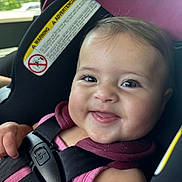 Amelia joined the competition — help win amazing prizes! baby, child, car_seat, smiling, happy, face, infant, seatbelt, safety, vehicle, cute, portrait, closeup, child_seat, straps, young_child, car_interior, seat, person, toddler