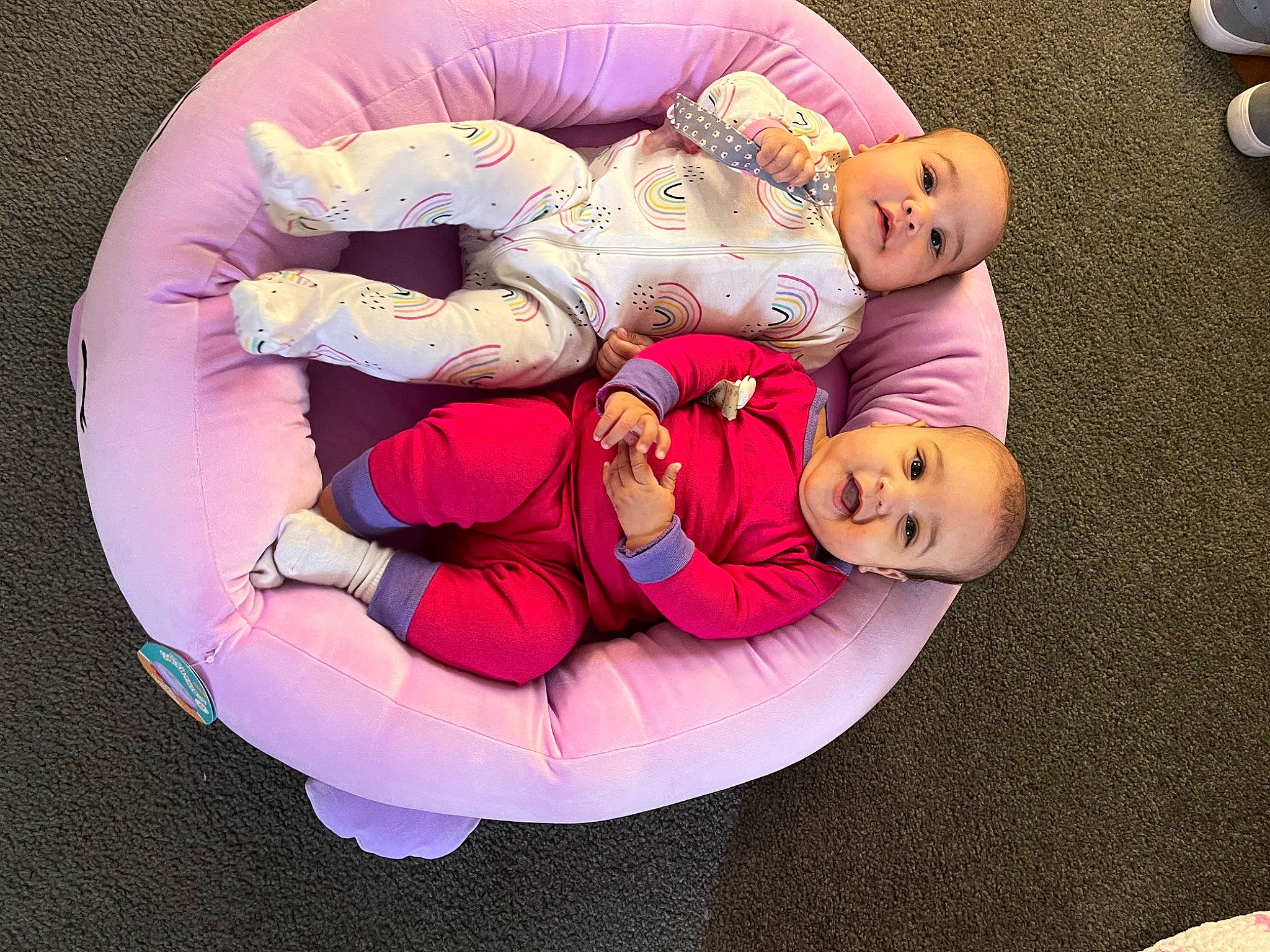 Mckenzie is registered to the contest to win money with this photo: baby, baby_products, baby_toddler_clothing, child, comfort, event, fun, happy, hat, human_leg, lap, leisure, magenta, nap, person, pink, room, smile, textile, thigh