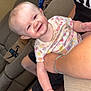 Embri joined the competition — help win amazing prizes! baby, smiling, onesie, child, couch, living_room, person, happy, holding, arm, blanket, cardboard_box, indoor, infant, cute, sitting, clothing, skin, head, face