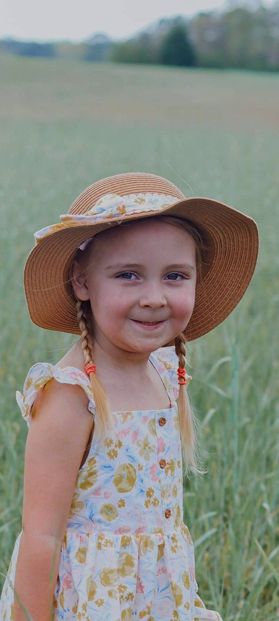 Teigan is registered to the contest to win money with this photo: clothing, eye, face, facial_expression, fun, grass, happy, hat, headgear, headwear, human_body, iris, joy, lip, people_in_nature, person, plant, skin, smile, summer