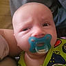 baby, pacifier, infant, face, person, clothing, colorful, closeup, expression, child, young, cute, skin, head, eyes, mouth, wearing, indoor, holding, puzzled