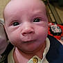 baby, infant, face, eyes, clothing, button, closeup, indoor, person, portrait, skin, head, expression, newborn, curious, young, child, human, apparel, blanket