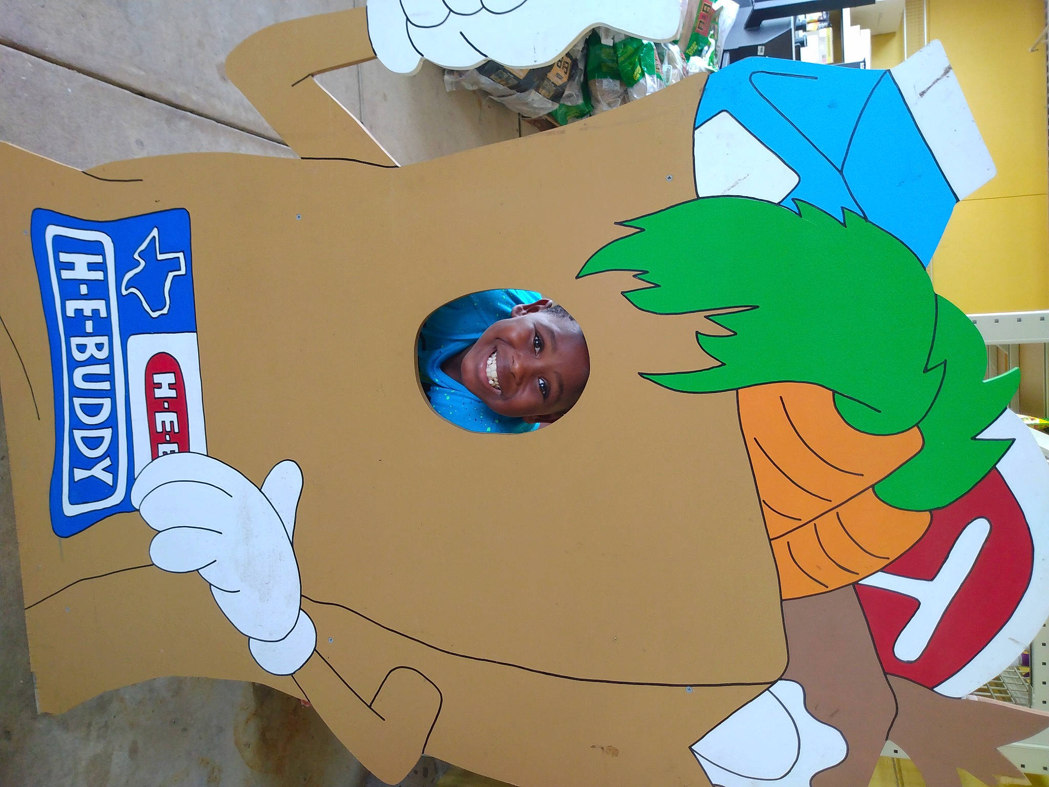 Brayden is registered to the contest to win money with this photo: animation, art, circle, event, fictional_character, font, fun, gesture, graphics, happy, headwear, illustration, joy, leisure, mural, natural_environment, organism, person, room, smile