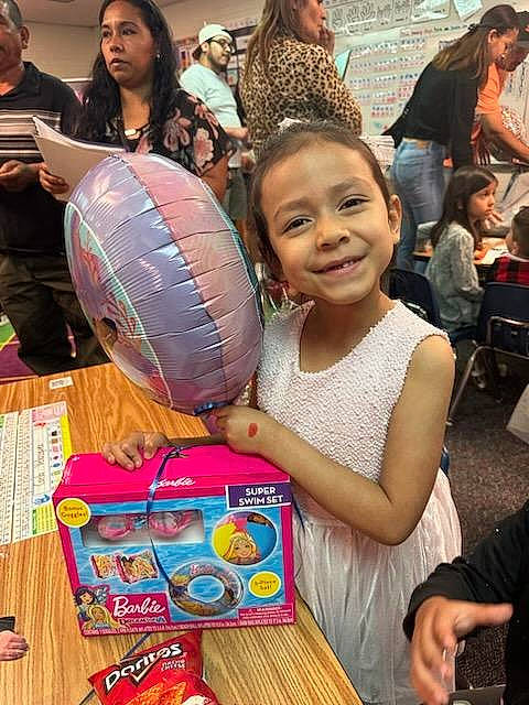 Alayla is registered to the contest to win money with this photo: bag, ball, child, drum, event, fun, happy, headwear, idiophone, joy, junk_food, leisure, luggage_and_bags, membranophone, musical_instrument, person, personal_protective_equipment, recreation, shorts, smile