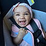 baby, baby_girl, car_interior, car_seat, child, child_seat, closeup, cute, face, happy, headband, indoor, infant, person, pink_clothing, portrait, safety, seatbelt, smiling, toddler