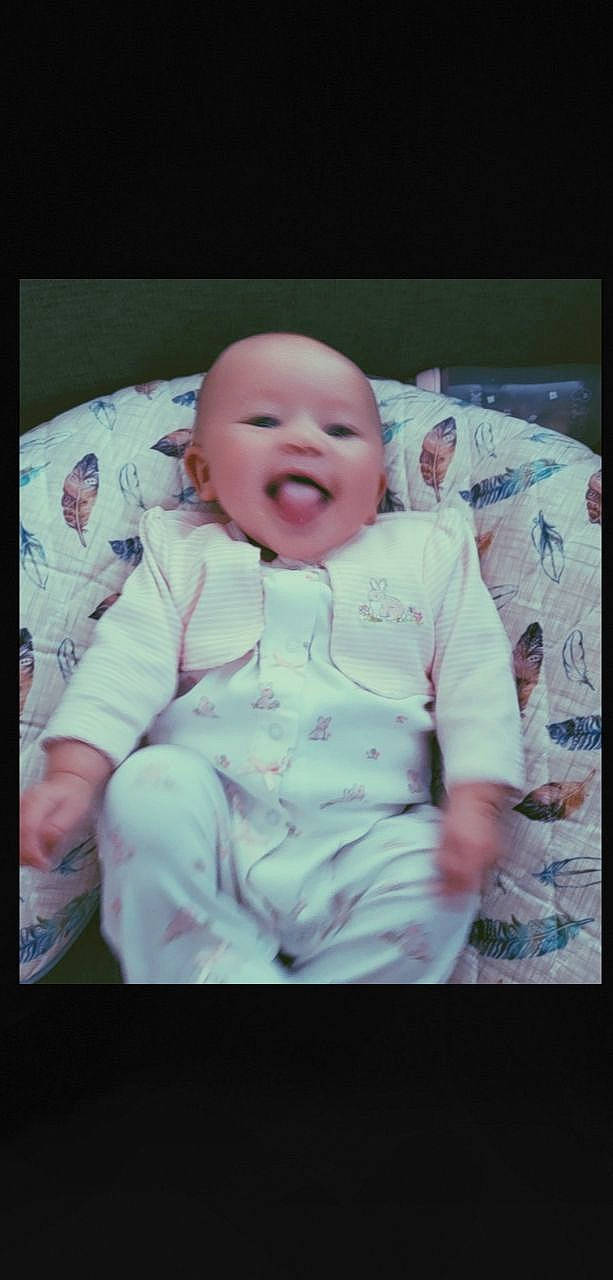 Graelyn is registered to the contest to win money with this photo: baby, baby_toddler_clothing, cheek, comfort, eye, eyebrow, flash_photography, gesture, happy, human_body, iris, lip, mouth, nose, person, pink, skin, sleeve, smile, textile