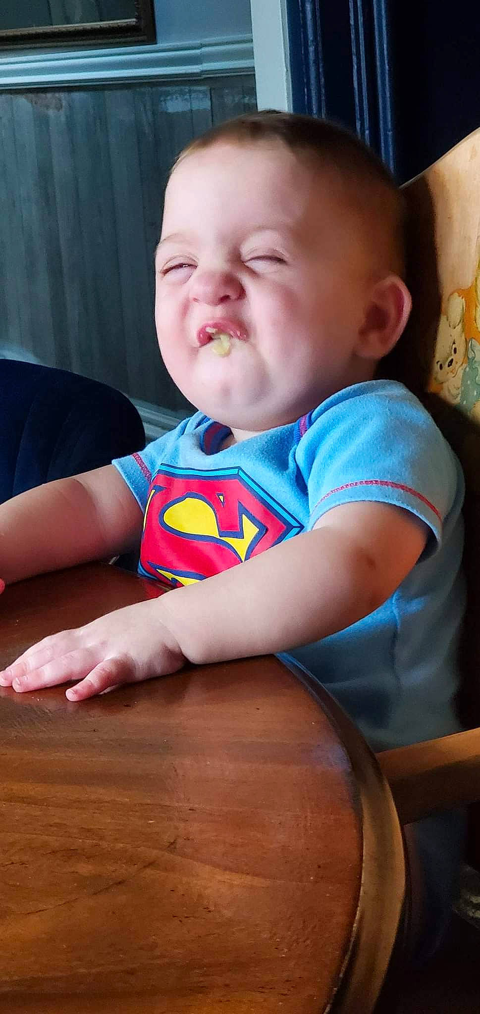 Xavior is registered to the contest to win money with this photo: arm, baby, baby_toddler_clothing, cheek, chin, clothing, eye, facial_expression, finger, happy, iris, mouth, nose, orange, person, product, skin, sleeve, smile, standing