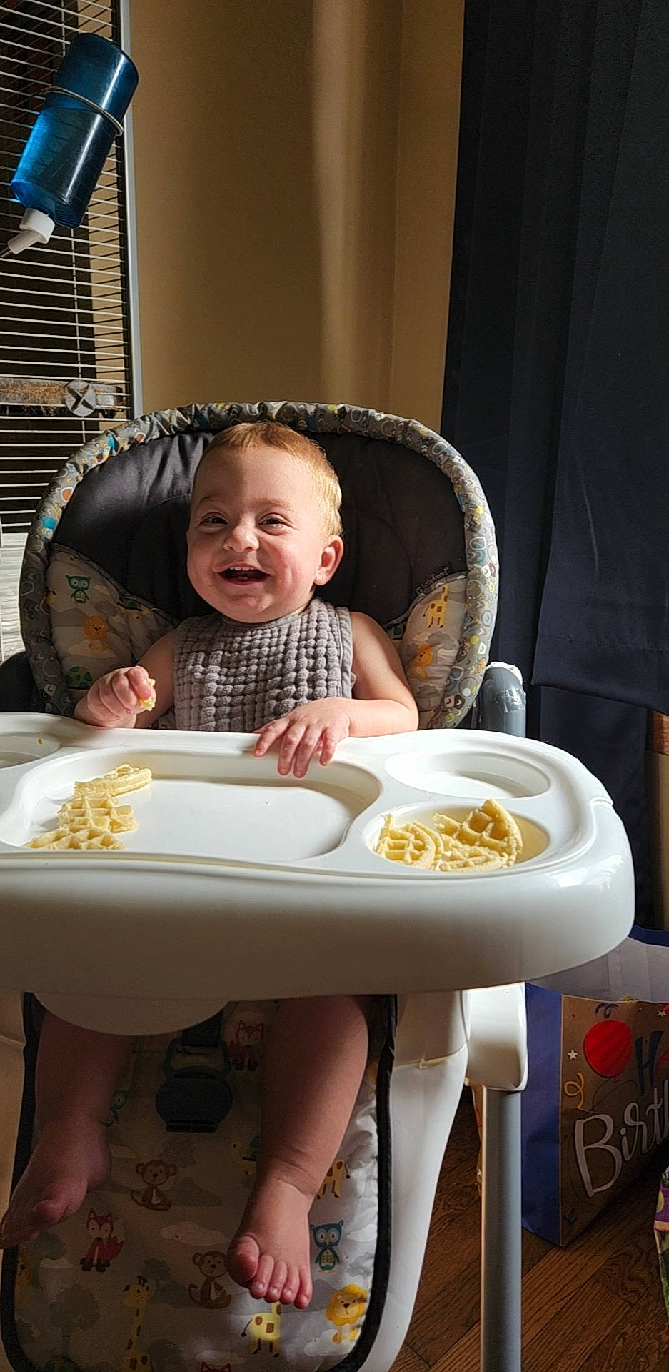 Xavior is registered to the contest to win money with this photo: baby, baby_toddler_clothing, bowl, chair, child, comfort, cooking, cuisine, dishware, eating, food, food_craving, happy, joy, person, plate, sharing, sitting, smile, table