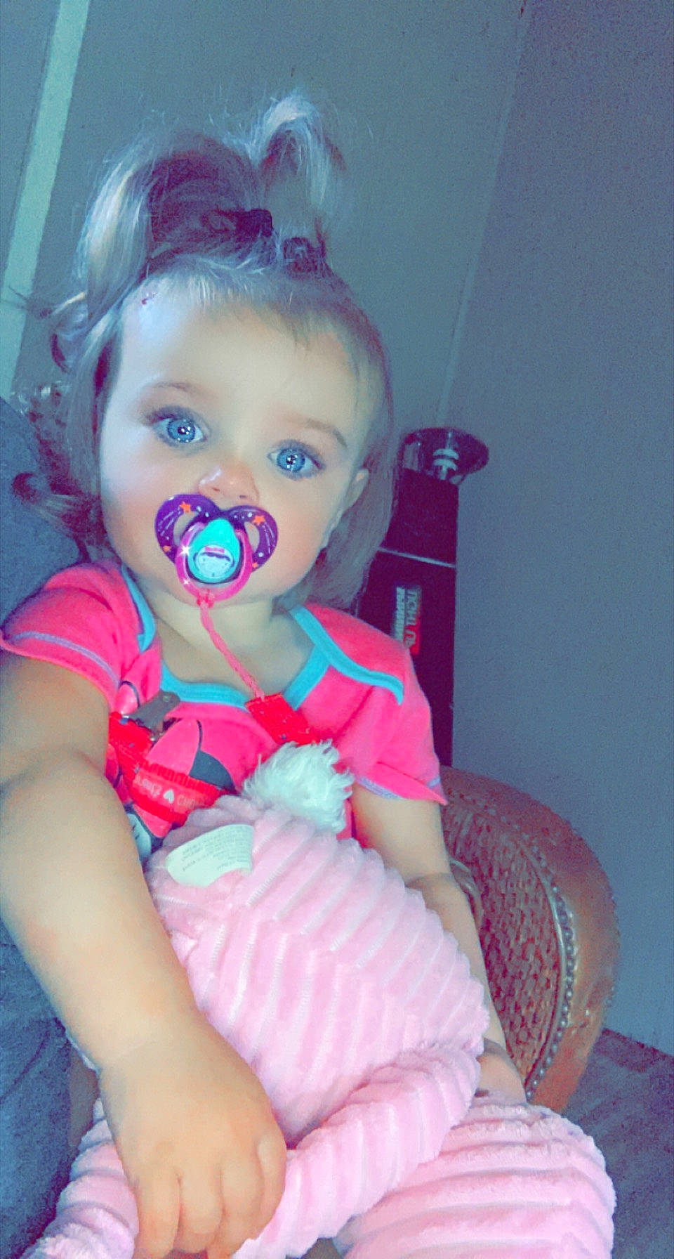 River is registered to the contest to win money with this photo: baby, baby_toddler_clothing, chair, cheek, comfort, cool, electric_blue, eyebrow, eyelash, happy, iris, lip, magenta, mouth, neck, person, pink, purple, skin, sleeve