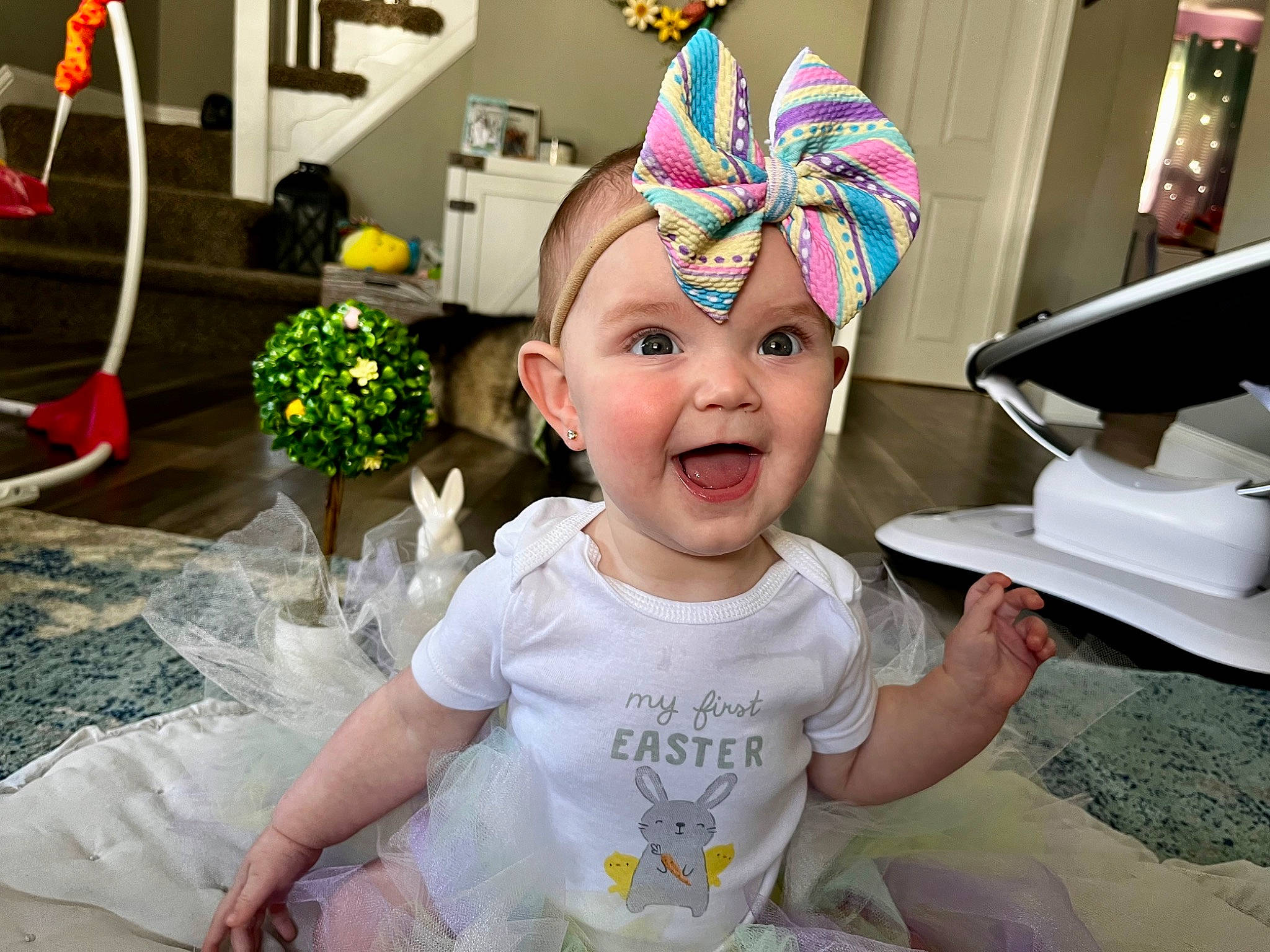 Aubree is registered to the contest to win money with this photo: baby, baby_toddler_clothing, cap, child, costume_hat, event, flower, flowerpot, fun, happy, hat, headband, headpiece, headwear, party_supply, person, photograph, pink, plant, smile