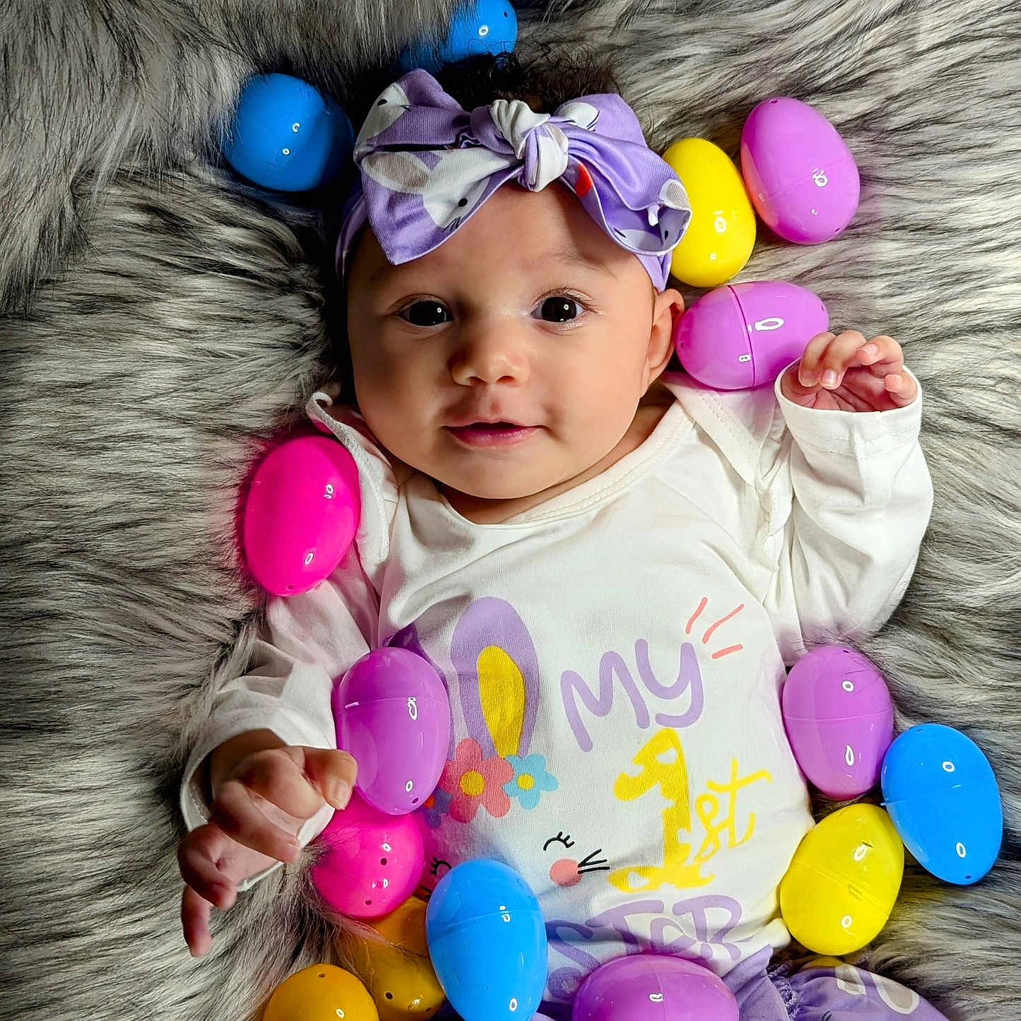 Kalia is registered to the contest to win money with this photo: baby, balloon, bodypart, clothing, couch, egg, face, finger, food, furniture, hand, hat, head, newborn, people, person, photography, portrait, purple, sweets