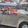 Jacob joined the competition — help win amazing prizes! child, boy, carnival, ride, car, spiderman_shirt, outdoor, fair, amusement_park, people, vehicle, toy_car, fun, daytime, park, childrens_ride, family, amusement, waiting, expression