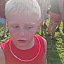 Jaxson is registered to the contest to win money with this photo: child, blonde, red_tank_top, outdoor, daylight, grass, crowd, people, summer, portrait, expression, face, casual_clothing, standing, sunlight, festival, event, young, person, blurred_background