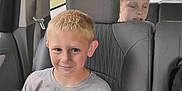 Jaxson joined the competition — help win amazing prizes! child, boy, car, backseat, seat, window, road, vehicle, gray, tshirt, smile, portrait, interior, seatbelt, hair, face, casual, young, sitting, travel
