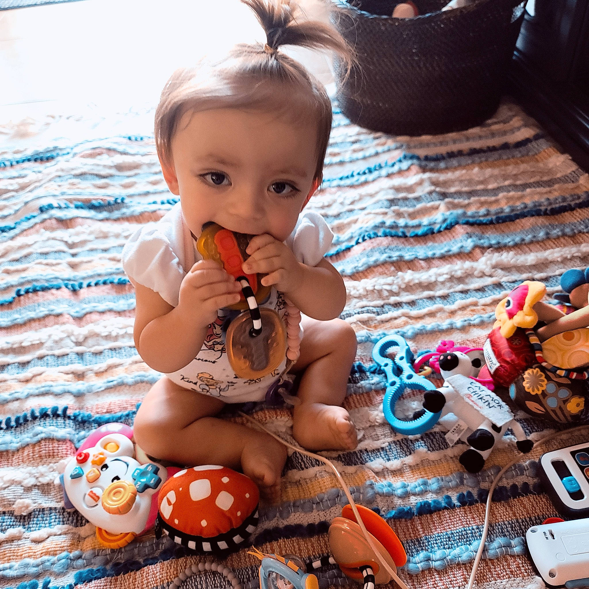 Juniper is registered to the contest to win money with this photo: baby, baby_products, baby_toddler_clothing, baby_toys, child, doll, fawn, flooring, fun, happy, human_leg, pattern, person, play, sitting, skin, stuffed_toy, thigh, toddler, toy